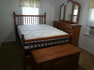 Elberton GA Deluxe Spindle Headboard with Softside Waterbed and Hope Chest